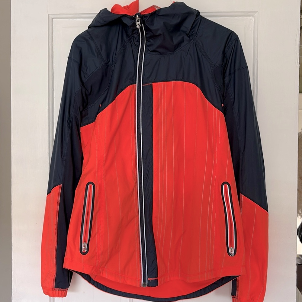 Lululemon running jacket. Navy / orange w/ reflector strips, size 8
